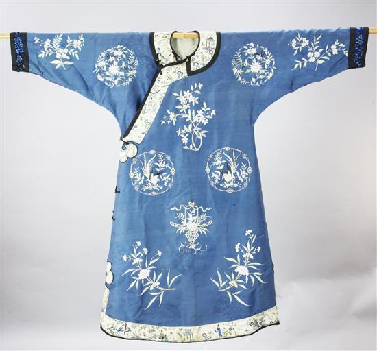 A Chinese blue silk damask womans robe, late 19th century, length 116cm, faults